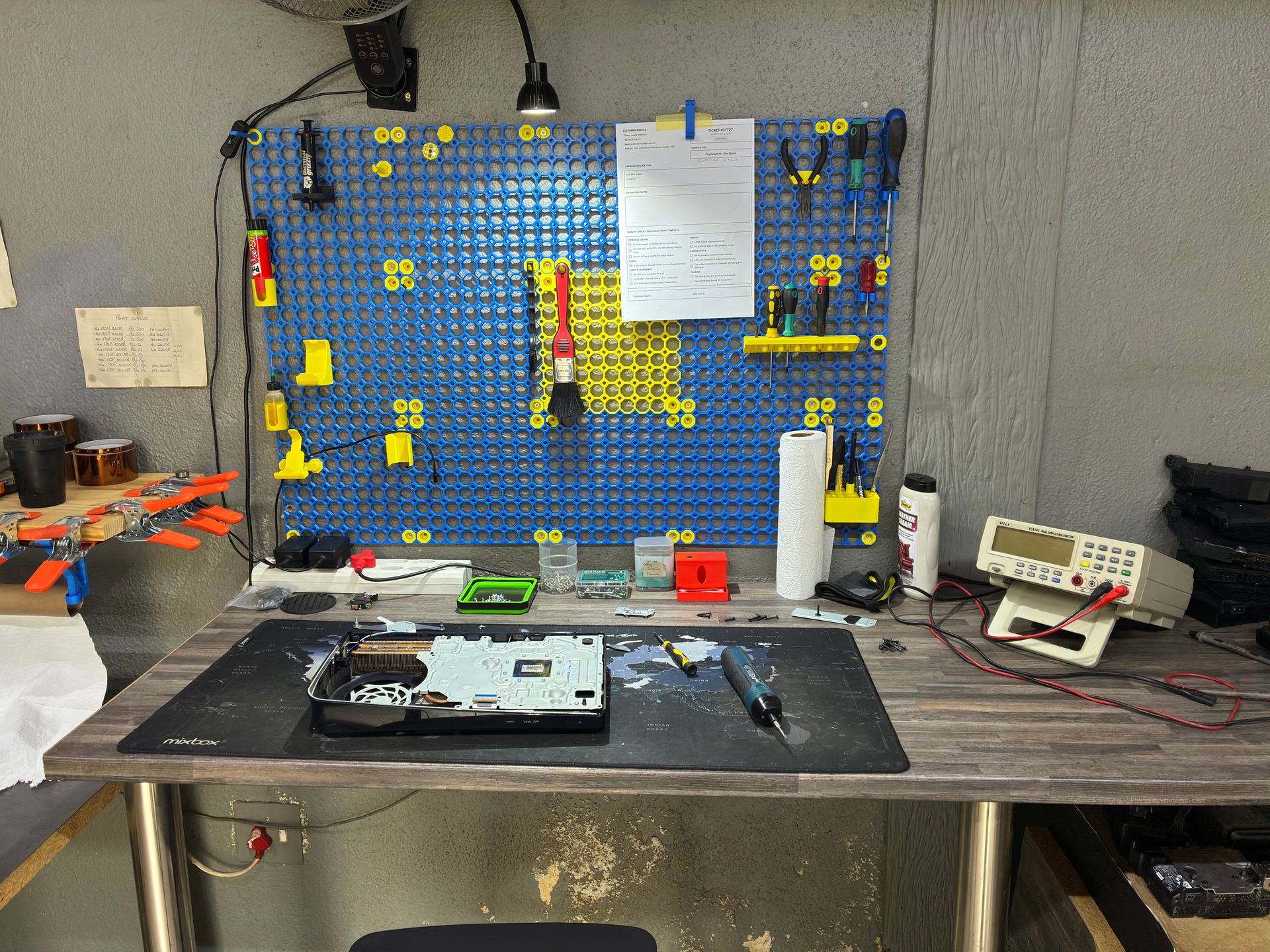 Properly organised professional repair workstation with correct tools and equipment at Console Service Centre